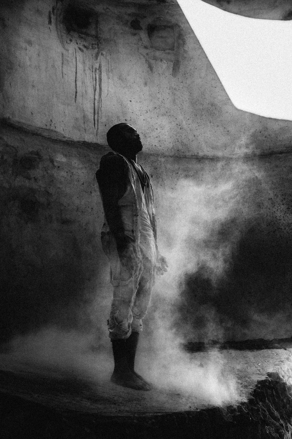 Ali Sardar standing in smoke