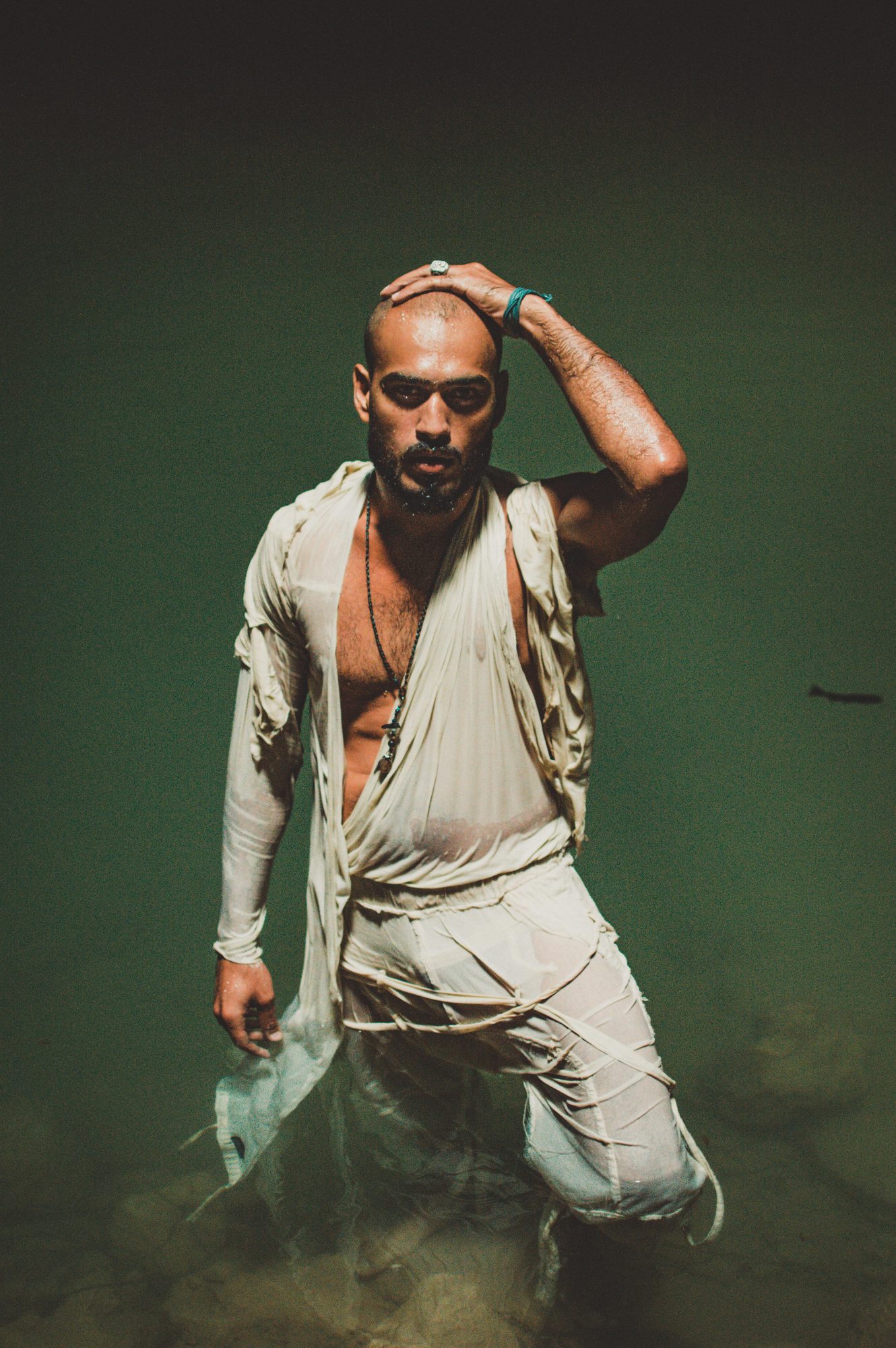 Ali Sardar standing in dark water